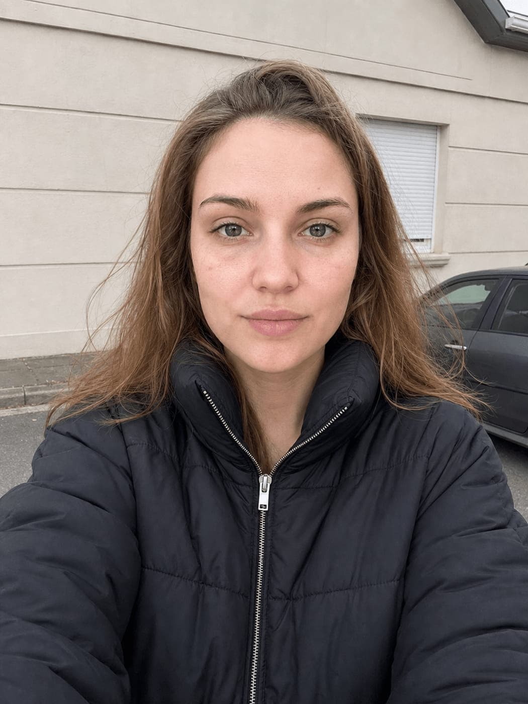 Selfie taken outdoors on an overcast street